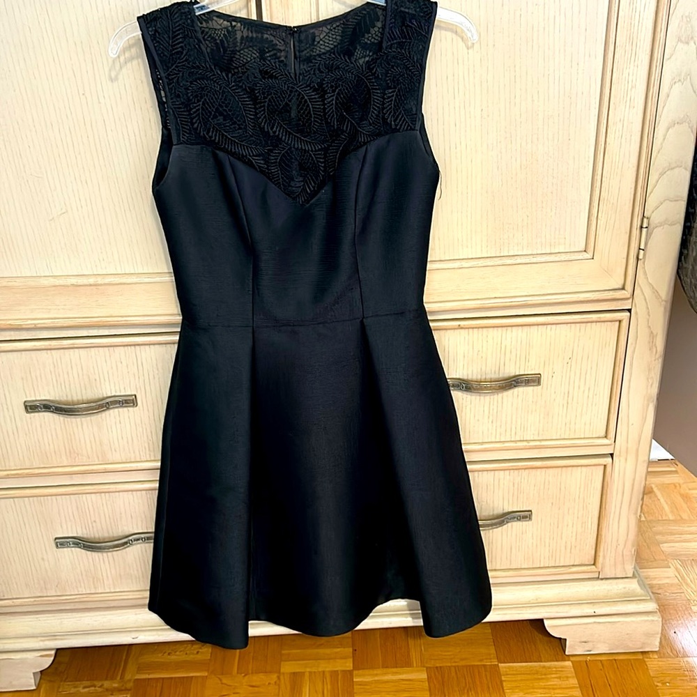 Beautiful black with lace cocktail dress.  Fits beautifully.